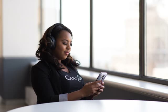 Support agent answering a call at a window desk